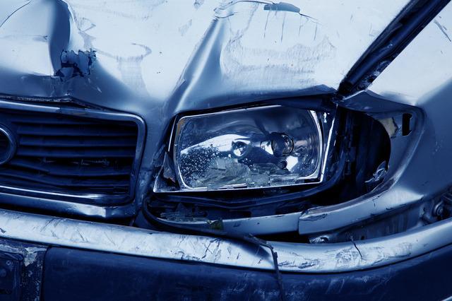 sell a broken-down car- the front end of a broken-down car, damaged and dented car bonnet