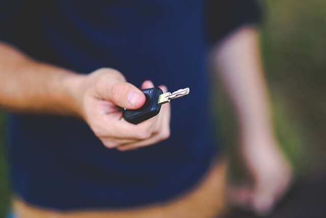 Car key in someone's hand